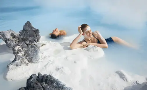 Guests enjoying the waters of the Blue Lagoon from a private transfer tour.